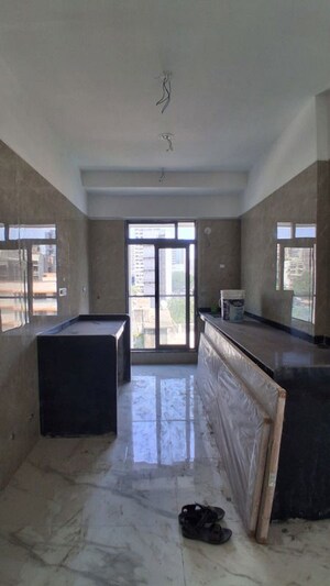 Kitchen in 3 BHK Apartment at Laxmi Madhuvan, Malad East – for Rent