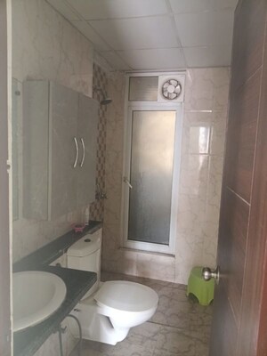 Bathroom in 2 BHK Apartment at Mahagun Mirabella, Sector 79 – for Sale