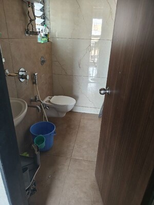 Bathroom in 2 BHK Apartment at Unnati Woods CHS, Kasarvadavali – for Rent