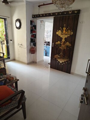 Living Room in 2 BHK Apartment at Unnati Woods CHS, Kasarvadavali – for Rent