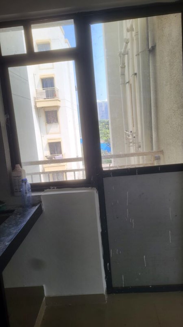 Kitchen, peninsula-address-one 3 Bedroom 653 Sq.Ft. Apartment In Gahunje Pune 10770082