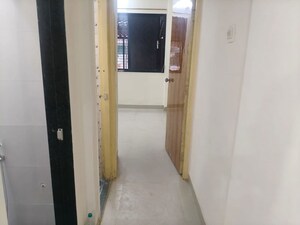 Building Lobby in 1 BHK Apartment at Mahavir Niwas, Nerul Sector 21 – for Rent