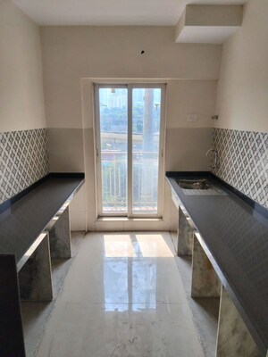 Kitchen in 2 BHK Apartment at Shree Tirupati STG Signature Residency, Patlipada – for Sale