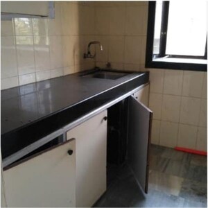 Kitchen in 2.5 BHK Apartment at Ashirwad Tower, Andheri West – for Rent
