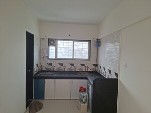Kitchen in 2 BHK Apartment at Kate Vimal Twin Towers, Pimple Saudagar – for Rent