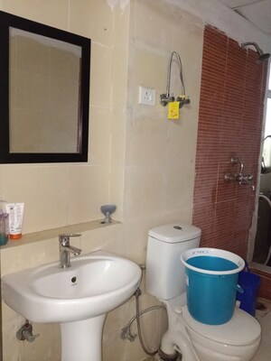 Bathroom in 3 BHK Apartment at Mahagun My Woods, Sector 16c Greater Noida – for Rent