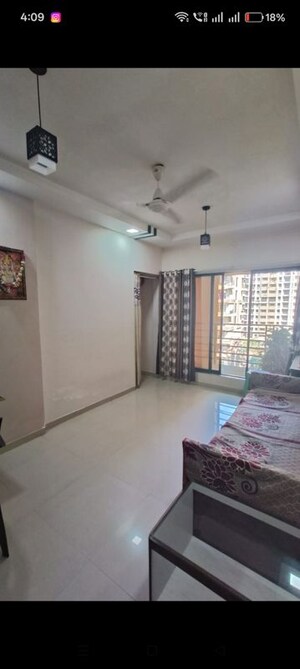 Living Room in 2 BHK Apartment at Cosmos Legend, Virar West – for Rent