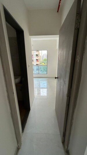 Building Lobby in 2 BHK Apartment at Siddha Sky, Sion – for Rent