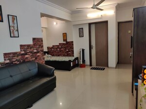 Living Room in 1 BHK Apartment at A And O Realty Eminente, Dahisar East – for Rent