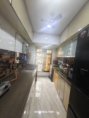 Kitchen in 3 BHK Apartment at Tilak Nagar – for Sale