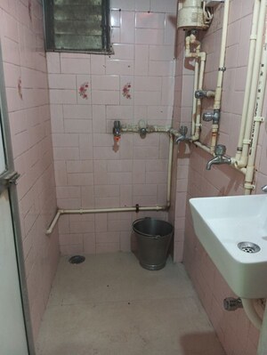 Bathroom in 1 BHK Apartment at Veena Sagar Cooperative Housing Society, Mulund West – for Rent