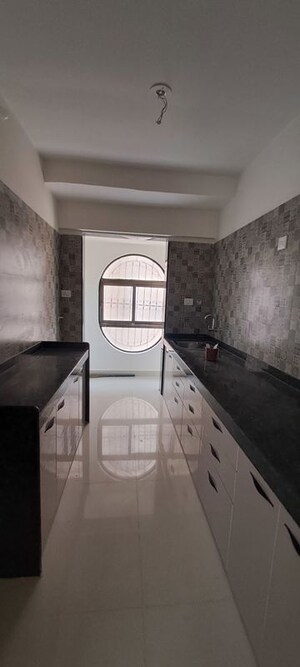 Kitchen in 2 BHK Apartment at Tharwani Millennium City, Badlapur East – for Sale