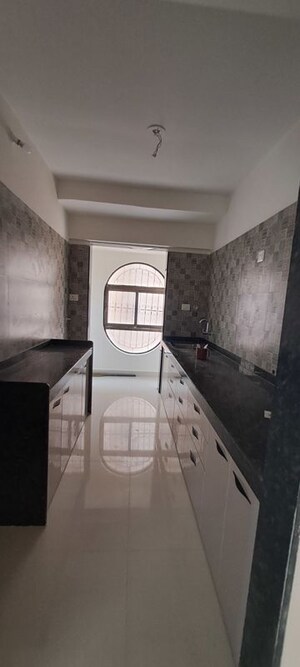 Kitchen in 2 BHK Apartment at Tharwani Millennium City, Badlapur East – for Sale