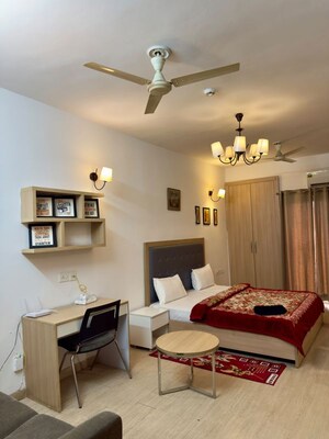 Living Room in 1 RK Apartment at Nimbus The Golden Palm, Sector 168 – for Rent
