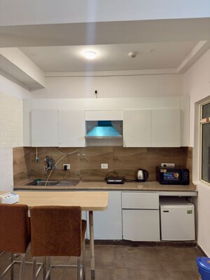 Kitchen in 1 RK Apartment at Nimbus The Golden Palm, Sector 168 – for Rent