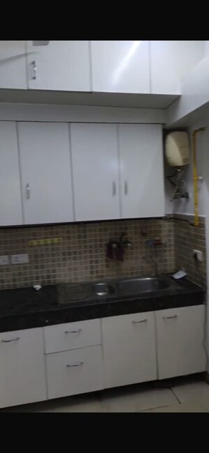 Kitchen in 3 BHK Apartment at Nimbus The Golden Palm, Sector 168 – for Rent