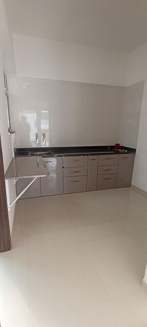Kitchen in 2 BHK Apartment at Goyal My Home Kiwale, Kiwale – for Rent