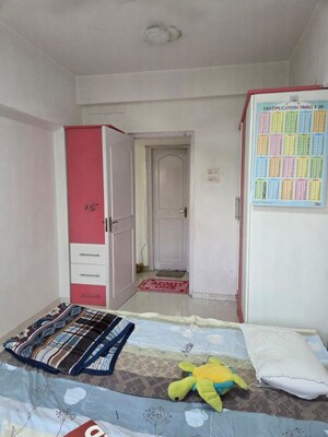 Bedroom in 2 BHK Apartment at Bredco Viceroy Court, Kandivali East – for Sale