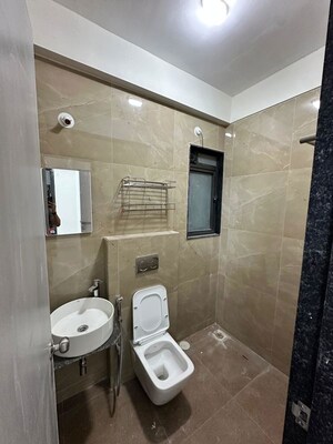 Bathroom in 1 BHK Apartment at Dhamji Shamji Mahavir Spring Tulip Phase 1, Pokhran Road No Two – for Rent
