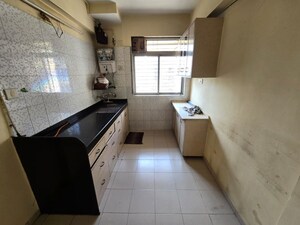 Kitchen in 2 BHK Apartment at Vasant Sagar, Kandivali East – for Rent