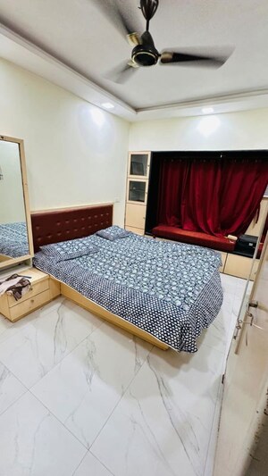 Bedroom in 2 BHK Apartment at Gayatri Darshan, Kandivali East – for Rent