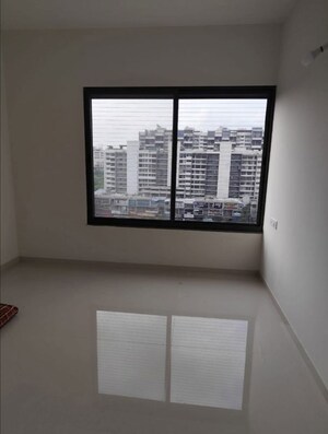 Bedroom in 2 BHK Apartment at Kumar Palmspring Towers, Undri – for Rent