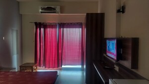 Living Room in Studio Apartment at Paramount Golfforeste, Zeta I Greater Noida – for Rent