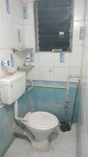 Bathroom in 1 BHK Apartment at Girnar Mahal CHS, Vasai West – for Rent