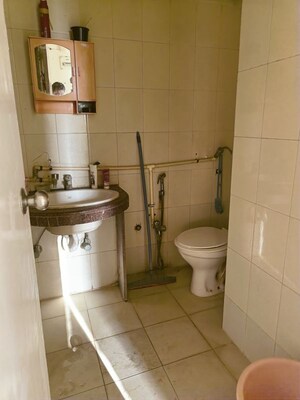 Bathroom in 1 BHK Apartment at Royal Palms Garden View, Goregaon East – for Rent