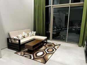 Living Room in Studio Apartment at M3M Corner Walk, Sector 74 – for Rent