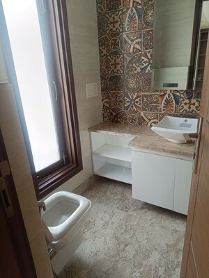 Bathroom in 4 BHK Builder Floor at Green Park Extension – for Rent