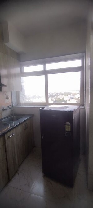 Kitchen in Studio Apartment at DLF Capital Greens Phase I And II, Moti Nagar – for Rent
