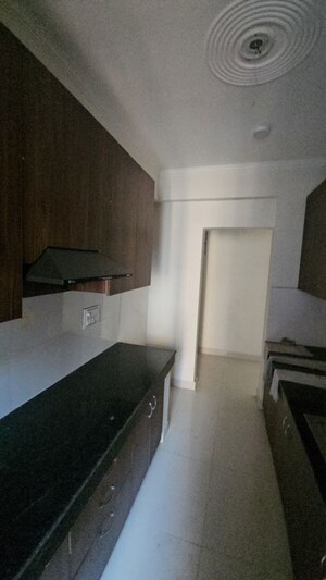 Kitchen in 2.5 BHK Apartment at Cosmos Express 99, Sector 99 – for Sale