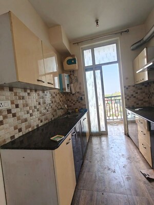 Kitchen in 2 BHK Apartment at Ansal API Celebrity Gardens, Sushant Golf City – for Rent