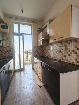 Kitchen in 2 BHK Apartment at Ansal API Celebrity Gardens, Sushant Golf City – for Rent