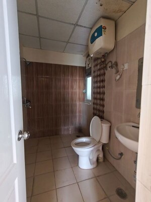 Bathroom in 2 BHK Apartment at Ansal API Celebrity Gardens, Sushant Golf City – for Rent