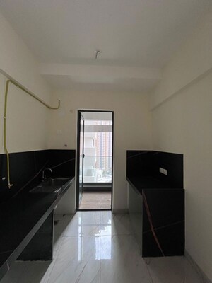 Kitchen in 1 BHK Apartment at Raunak Delight, Owale – for Rent
