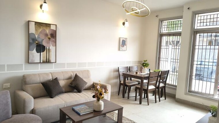Living Room, wave-floors-premium 2 Bedroom 932 Sq.Ft. Apartment In Wave City Ghaziabad 10780086