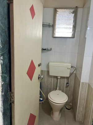 Bathroom in 1 BHK Apartment at Bindra Complex, Andheri East – for Rent