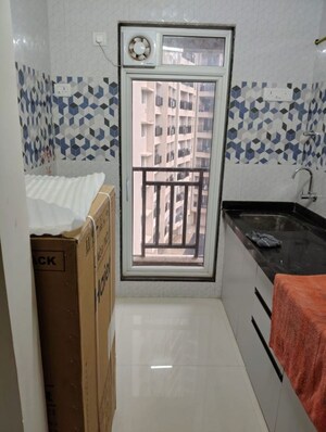 Kitchen in 1 BHK Apartment at Raunak Bliss, Ghodbunder Road – for Rent