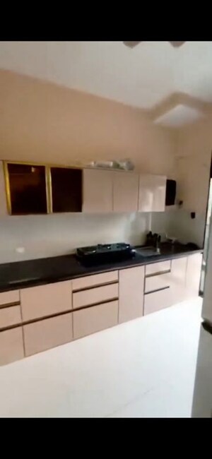 Kitchen in 2 BHK Apartment at Leo Tower Apartments, Juhu – for Rent