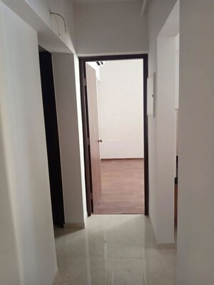 Living Room in 1 BHK Apartment at Lodha Palava City, Dombivli East – for Rent