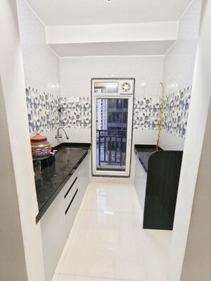 Kitchen in 1 BHK Apartment at Metropolis Rivera, Kasarvadavali – for Rent