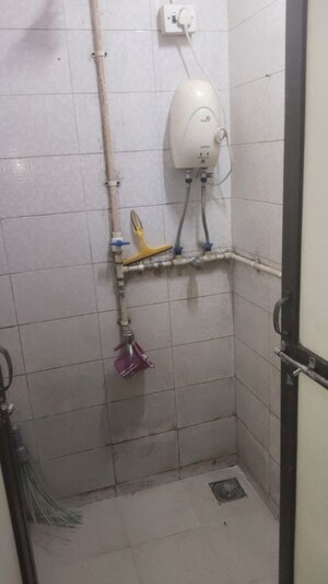 Bathroom in 1 BHK Apartment at Omkar SRA, Malad East – for Rent