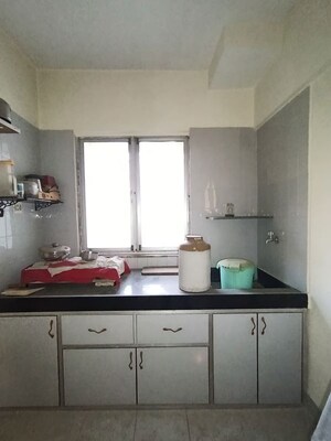 Kitchen in 2 BHK Apartment at Raj Sarita CHS, Dahisar East – for Sale