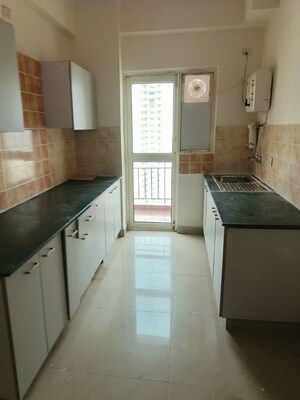 Kitchen in 2 BHK Apartment at Aims Golf City, Sector 75 – for Rent