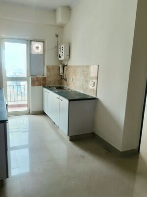 Kitchen in 2 BHK Apartment at Aims Golf City, Sector 75 – for Rent