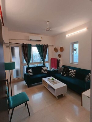 Living Room in 1 BHK Apartment at Lodha Versova, Versova – for Rent