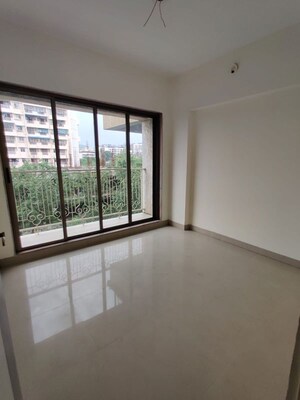 Living Room in 2 BHK Apartment at Pranjee Garden City, Katrap – for Sale