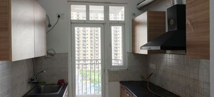 Kitchen in 2.5 BHK Apartment at ATS Happy Trails, Sector 10 Greater Noida – for Rent